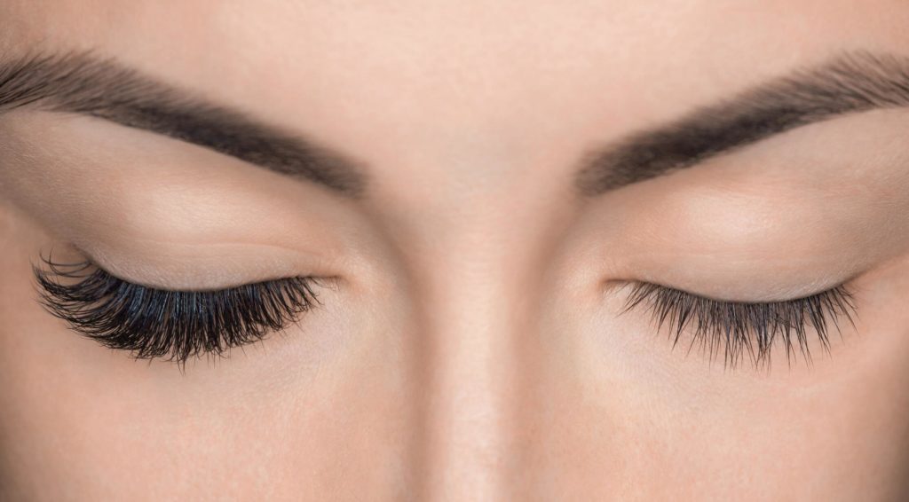Woman with lash extensions on one eye
